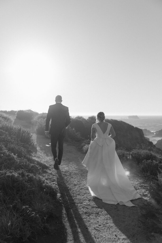 Couple walking along coastal trail at Garrapata State Park in Big Sur