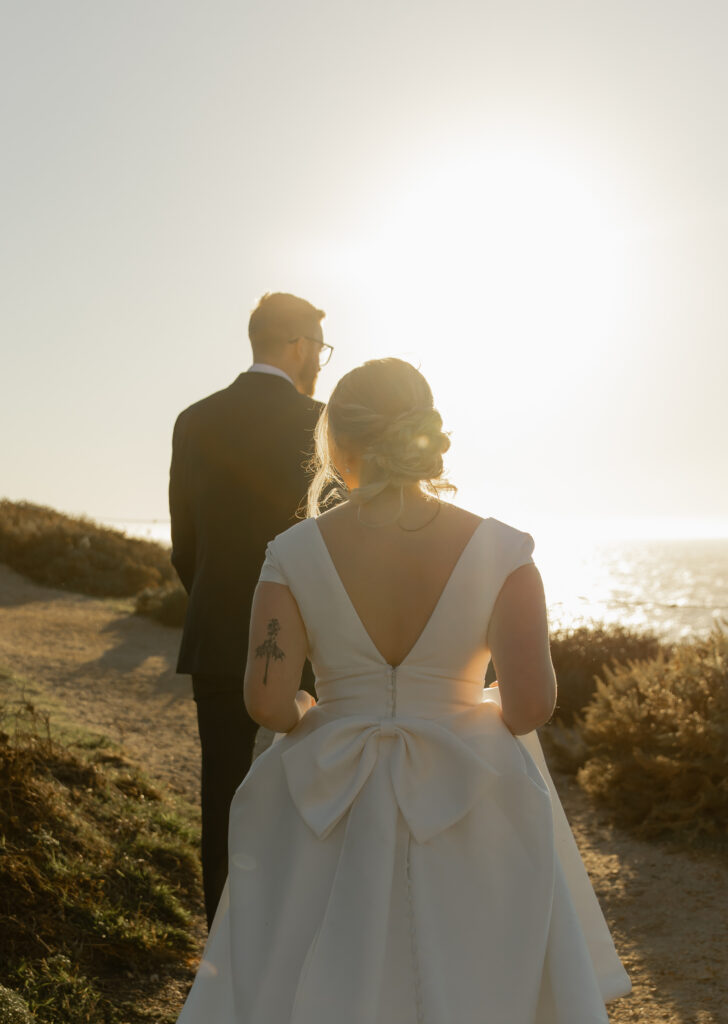 Bride and groom walking at Garrapata State Park during Big Sur elopement