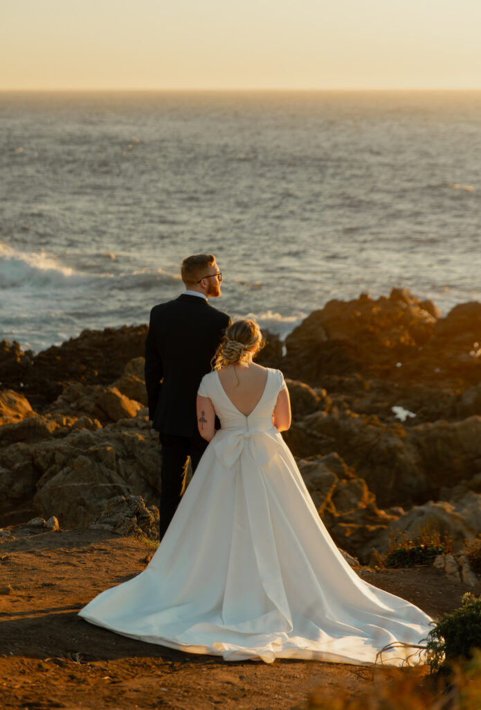 Bride and groom overlooking ocean at Garrapata State Park during Big Sur elopement