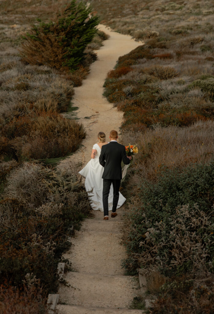 Couple walking along coastal trail at Garrapata State Park in Big Sur