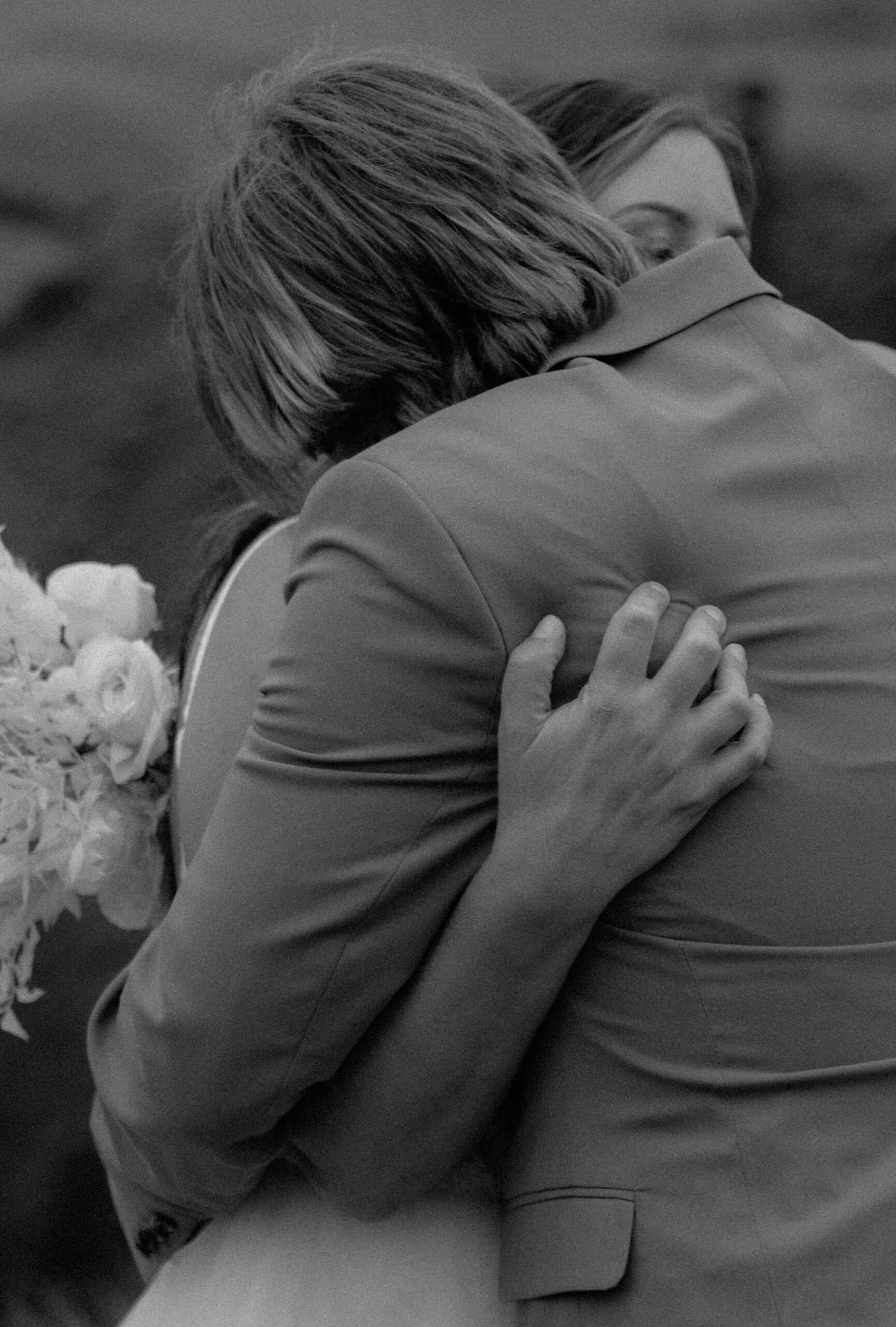 Emotional black and white portrait of couple embracing during Iceland vow renewal