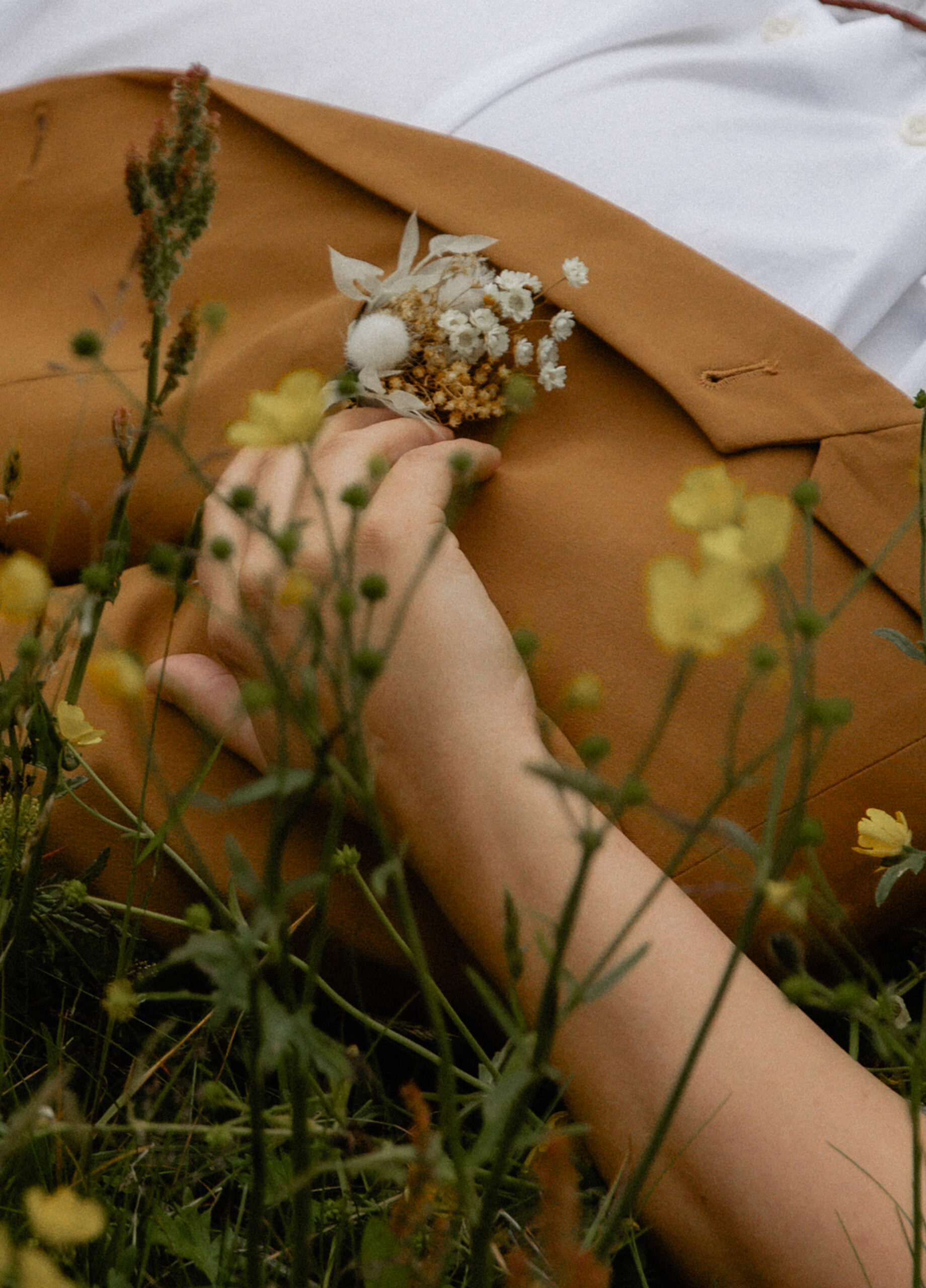 Close-up detail photo of bouquet and vow book in Iceland wildflowers
